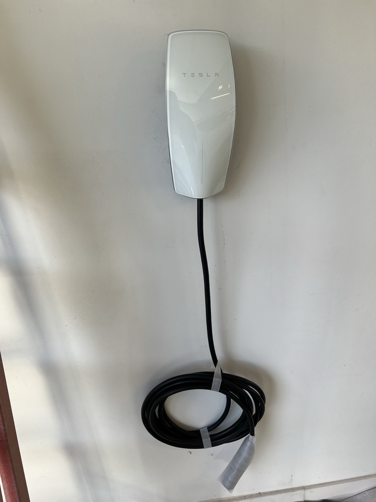 Tesla wall connector installed at a home